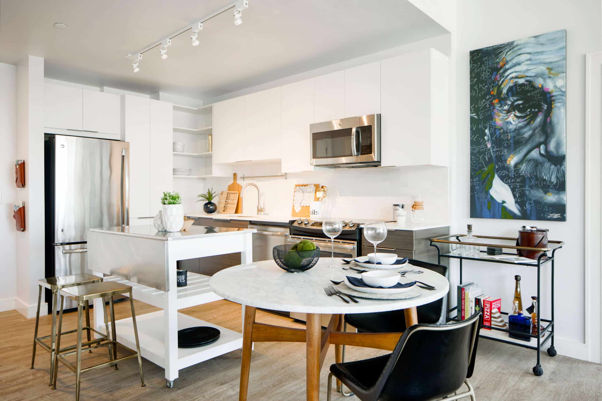 The kitchen at Dalian On The Park, showcasing modern appliances, sleek countertops, and ample cabinet space, providing residents with a stylish and functional area for cooking and dining.