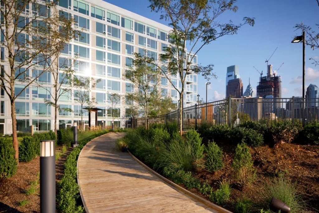 Exterior view of Dalian On The Park building, showcasing its modern architecture, glass façade, and surrounding urban landscape